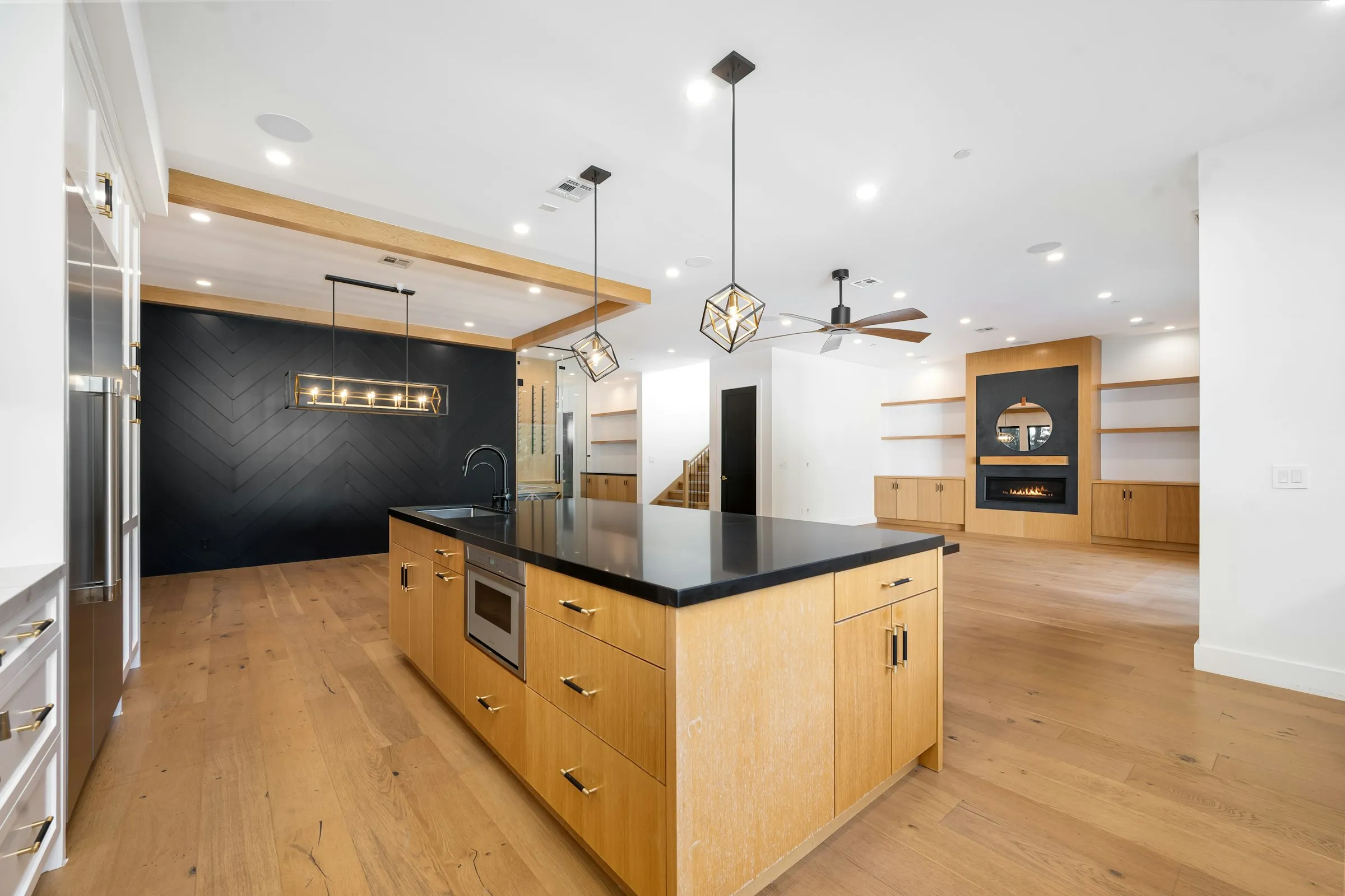 Open-plan kitchen renovation with stone-topped island