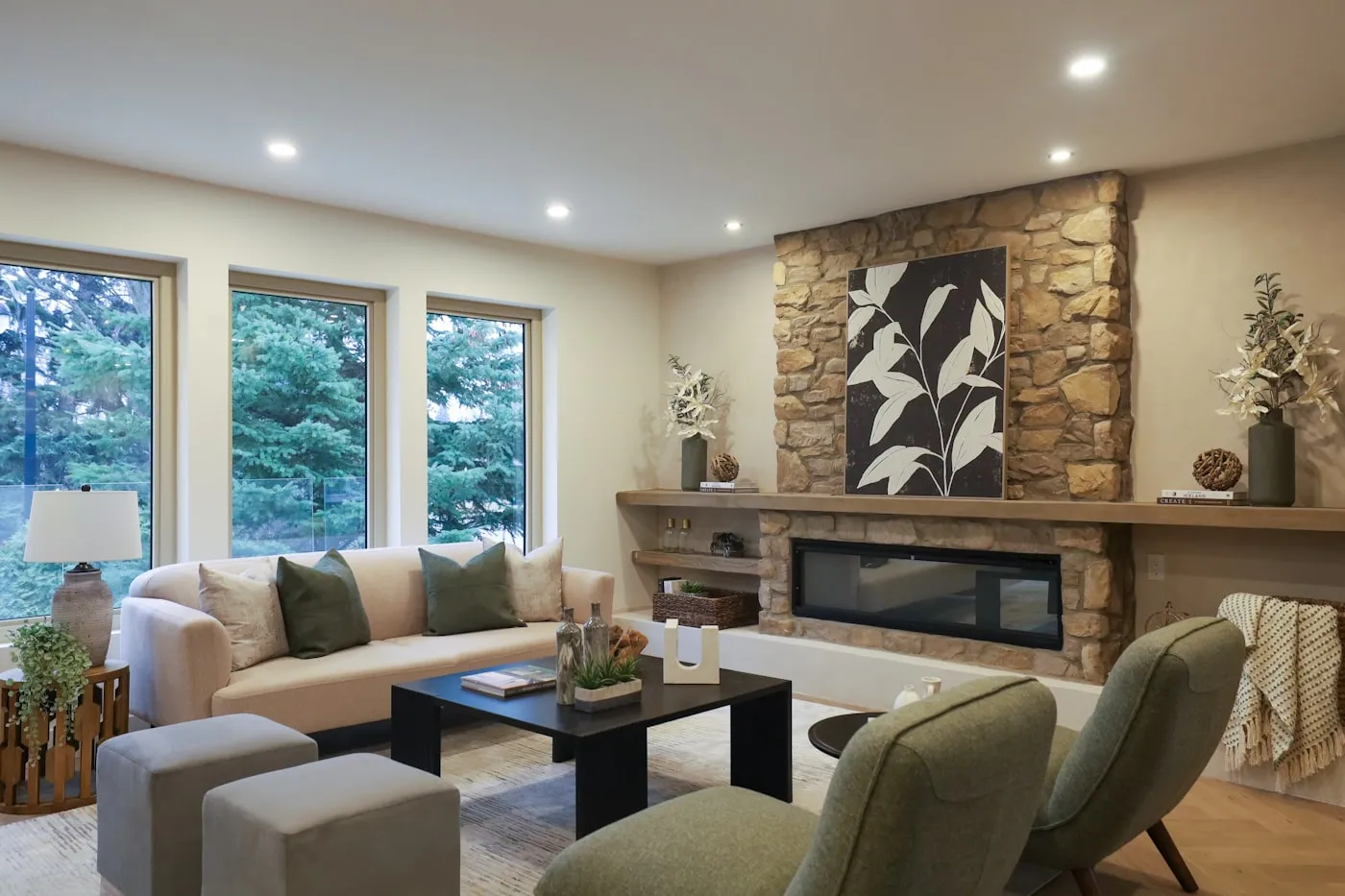 Living room with stacked stone fireplace surround