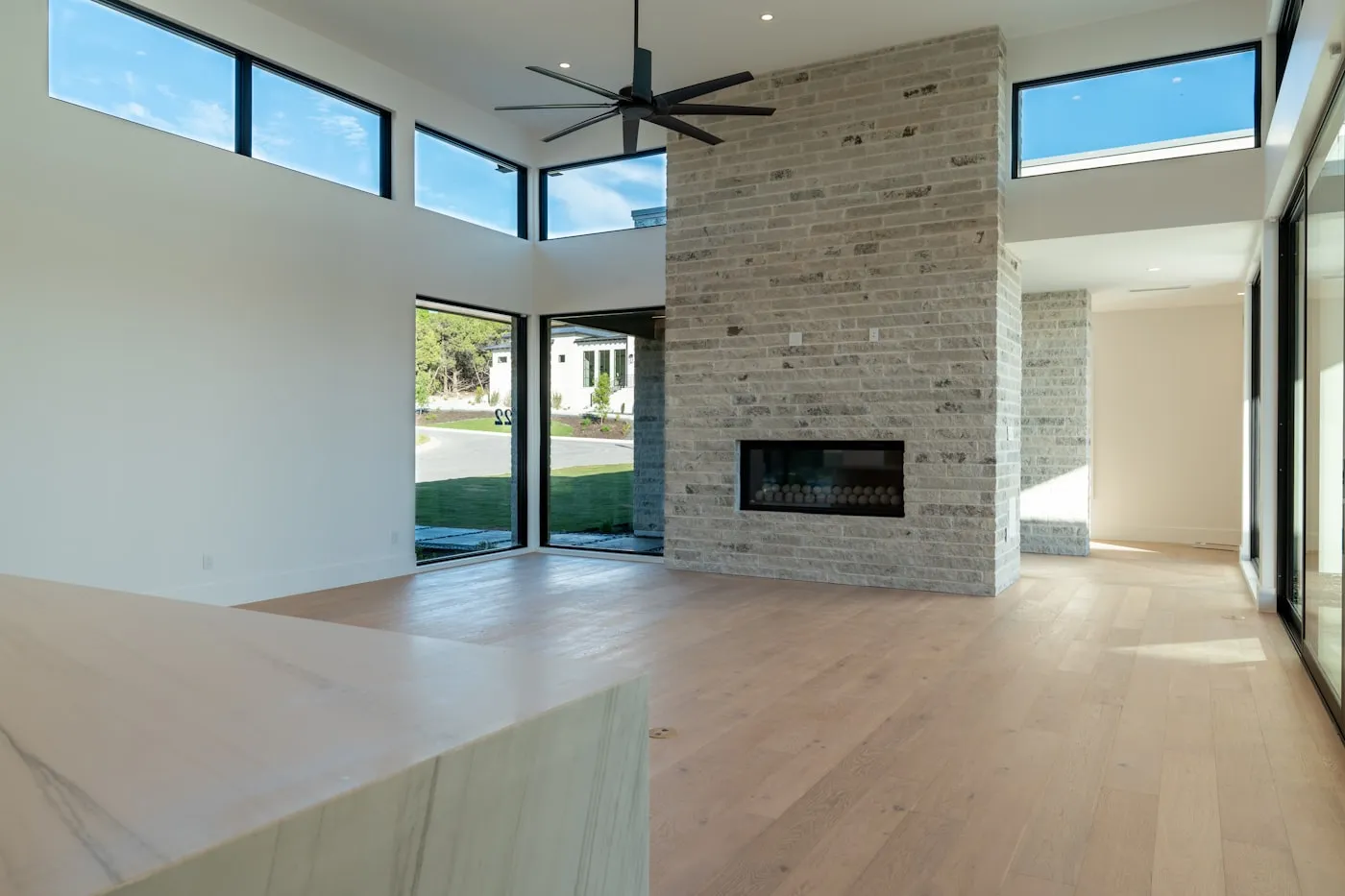 Great room with full-height brick fireplace