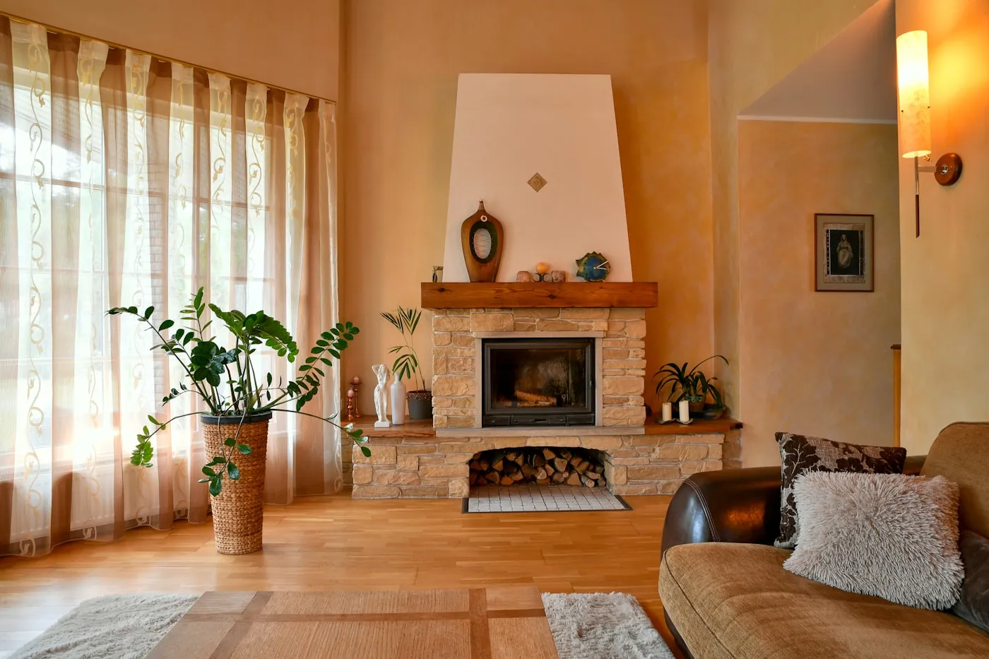 Rustic stone fireplace with timber mantel