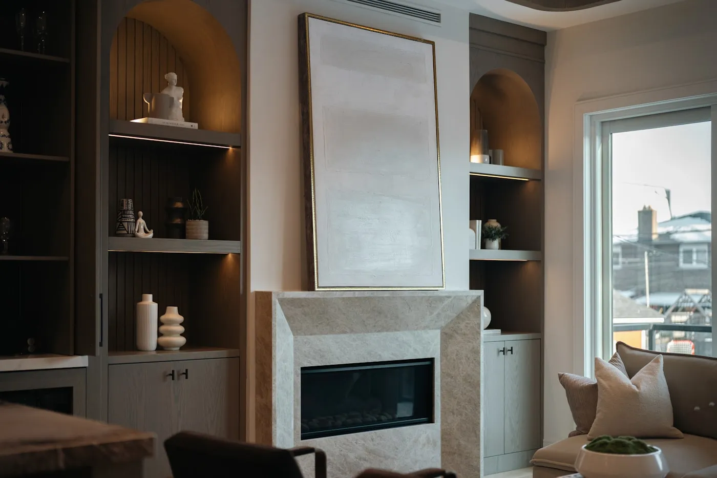 Marble fireplace surround with built-in shelving