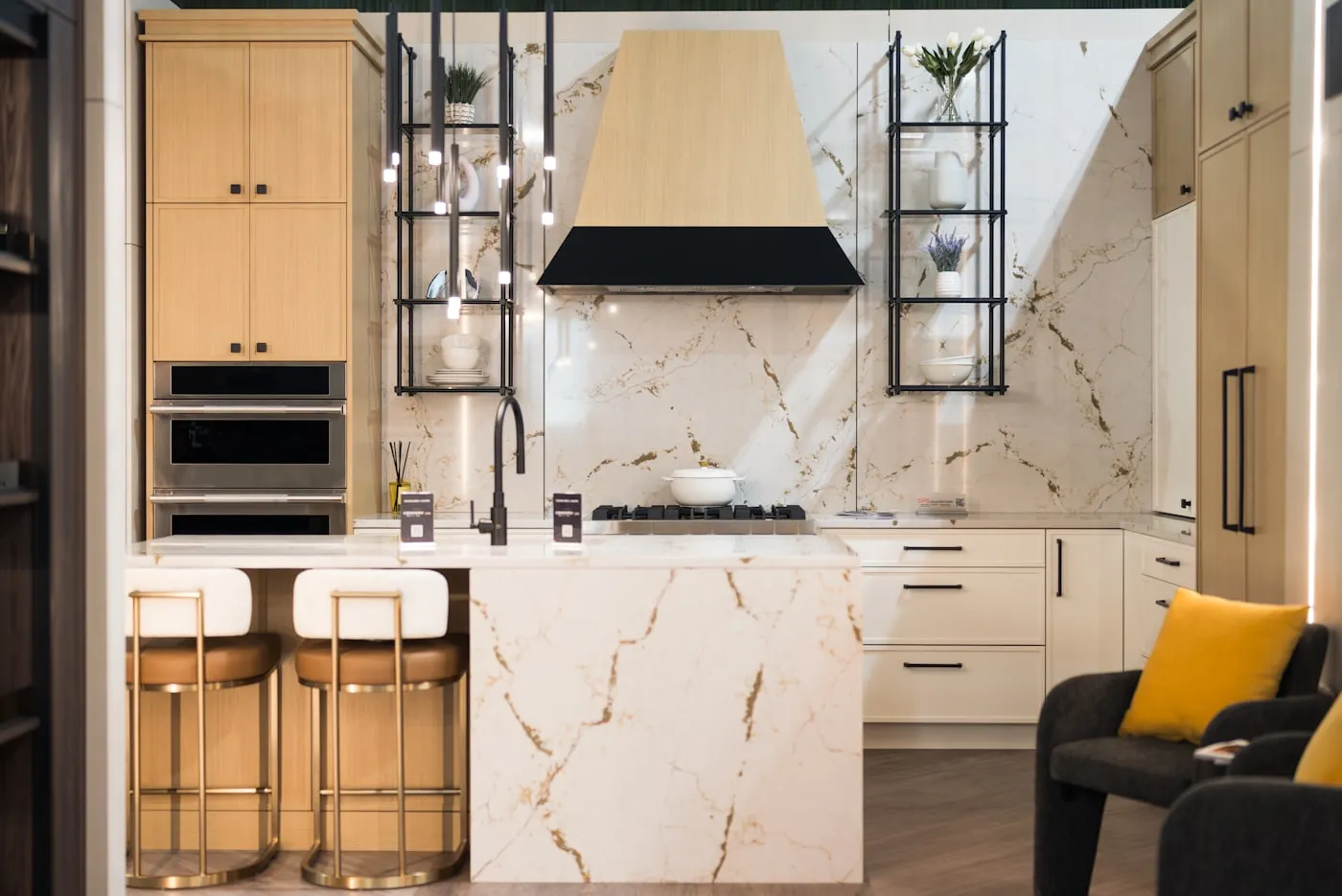 Kitchen with full-height calacatta marble backsplash and island